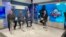 Euclides Rojas, Orlando "El Duque" Hernández y Brayan Peña, del equipo "Patria y Vida", el 5 del enero de 2024, de izquierda a derecha, y el moderador Camilo Loret de Mola, de MEGATV. (Imagen de OCB).