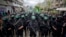 Militantes armados de Hamás conmemoran otro aniversario del grupo en la ciudad de Gaza, en diciembre de 2014. (AP/Khalil Hamra, File)