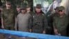 El general ruso Alexandre Dragovaloskiy, el gobernador de Apure, Ramon Carrizales, Ministro de Defensa de Venezuela Vladimir Padrino Lopez y el general cubano Joaquín Quintaas analizan la maqueta de "Escudo Soberano 2015". REUTERS/Marco Bello